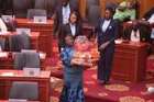Minister Dzifa Gomashie champions Made-in-Ghana chocolate on Parliament floor