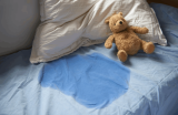 Guardian allegedly burns child over bedwetting; case withdrawn under pressure
