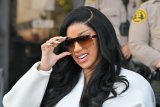 Cardi B loses it outside court and hurls a pen at ‘disrespectful’ reporter over pregnancy question