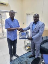 Gilbert Addy donates diaries to Ghana Gas board chairman Sipa Yankey