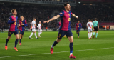 Barca edge out Rayo Vallecano to go top of La Liga