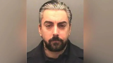 Two in court accused of killing jailed singer Watkins