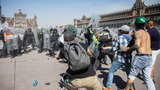 Thousands protest against government in Mexico as clashes leave 120 injured